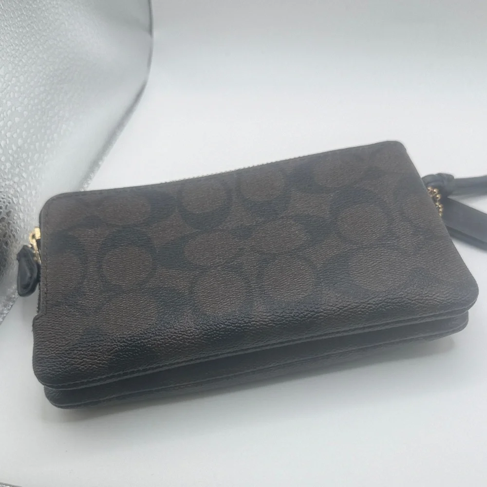 Coach signature‎ Brown Wristlet with Black and gold Accents
